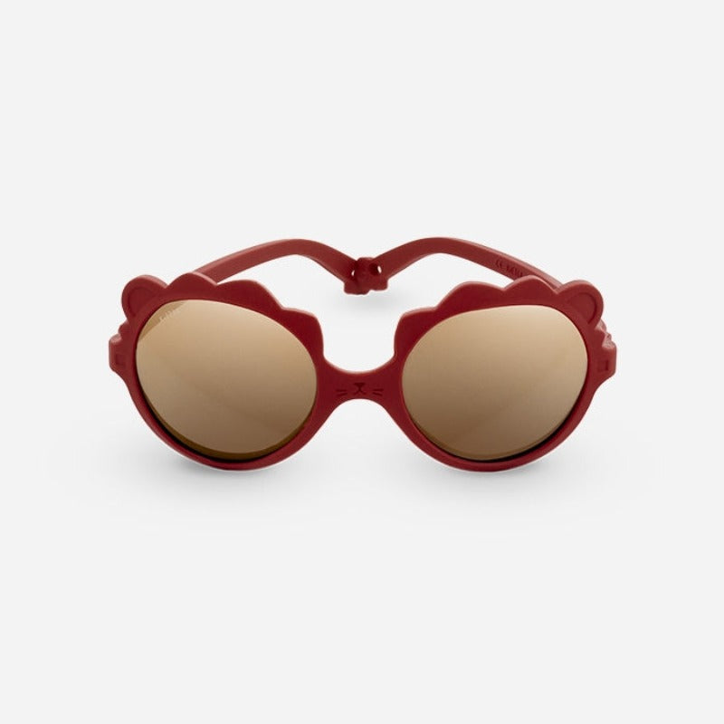 Lunettes solaires enfant de la marque Ki Et La, modèle lion coloris sienne. incassables, douce, légère, haute protection, made in France, eco friendly, the Must to have pour bébé