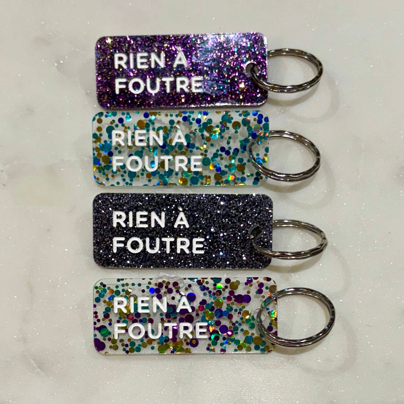 RIEN À FOUTRE Porte-clés à paillettes