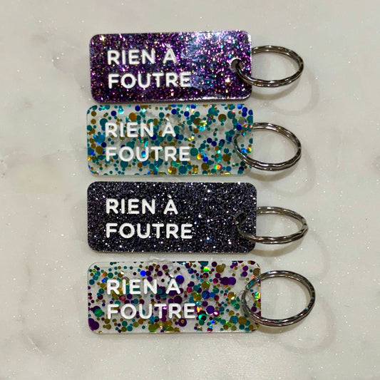 RIEN À FOUTRE Porte-clés à paillettes
