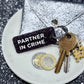 PARTNER IN CRIME Porte-clés à paillettes