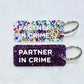 PARTNER IN CRIME Porte-clés à paillettes