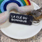 LA CLÉ DU BONHEUR Porte-clés à paillettes