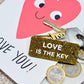 LOVE IS THE KEY  Porte-clés à paillettes