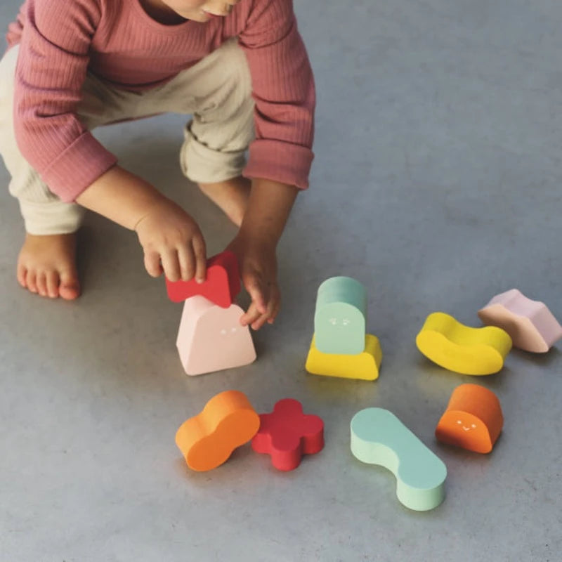 Ce jeu amusant de blocs Coral Pink à empiler contribue non seulement au développement de la motricité, mais stimule également la logique et la capacité à construire