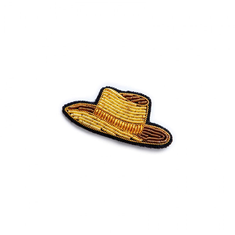Pour cowboy solitaire! Une broche toute dorée pour habiller simplement votre tenue.