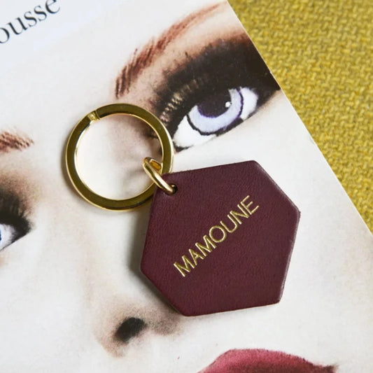 POrte-clés de la marque fauvette, en cuir avec un message en lettre dorée. Mamoune.