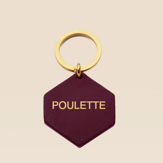 Porte-clés de la marque fauvette en cuir avec une inscription dorée Poulette. Création francaise fait à la main